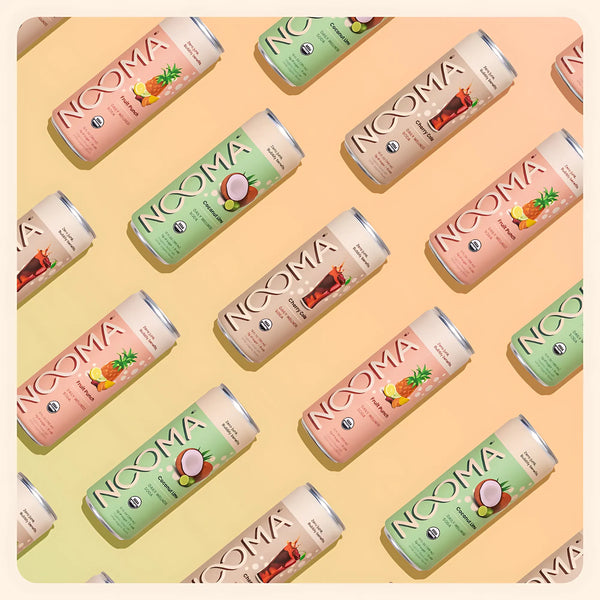 NOOMA organic wellness soda cans in assorted flavors