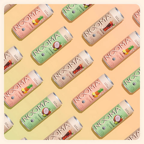 NOOMA organic wellness soda cans in assorted flavors