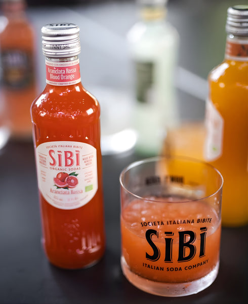 Sibì Organic Soda sparkling botanical beverage by Sibilla Waters in glass bottle with natural ingredients